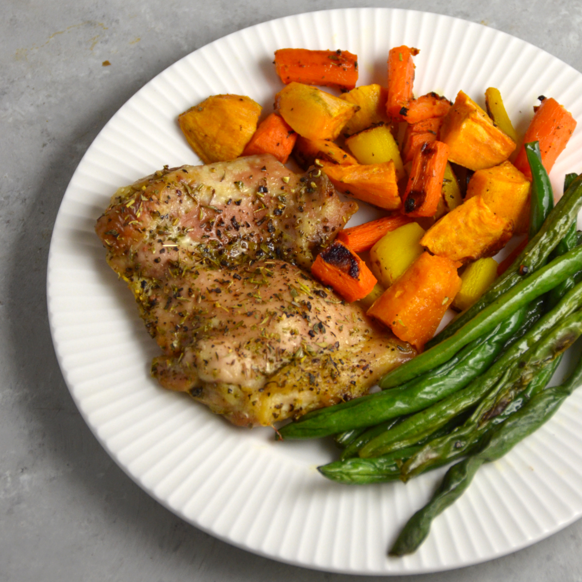 Sheet pan chicken with carrots, sweet potatoes and green beans is an easy meal prep.